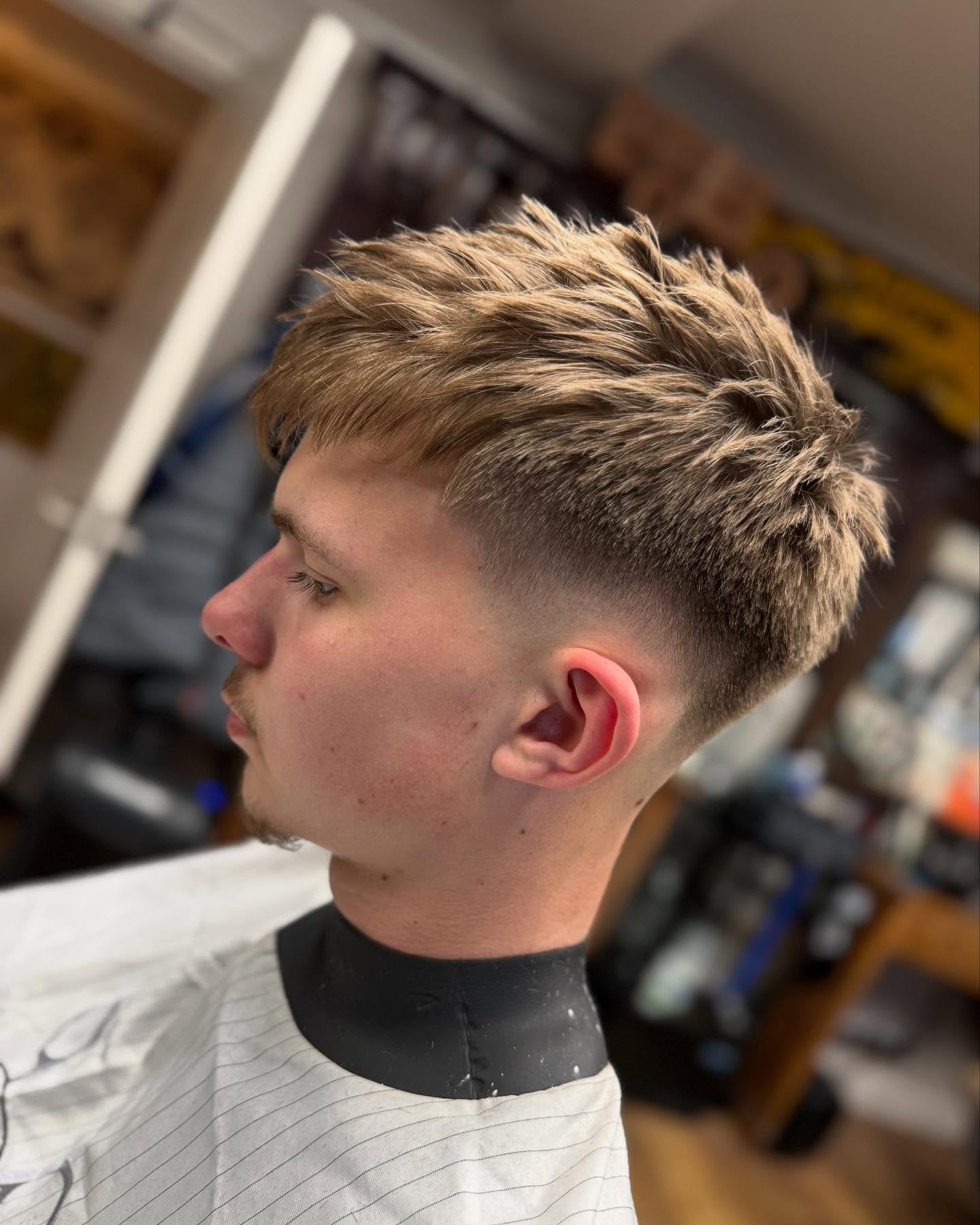 Textured crop with a skin fade, side profile